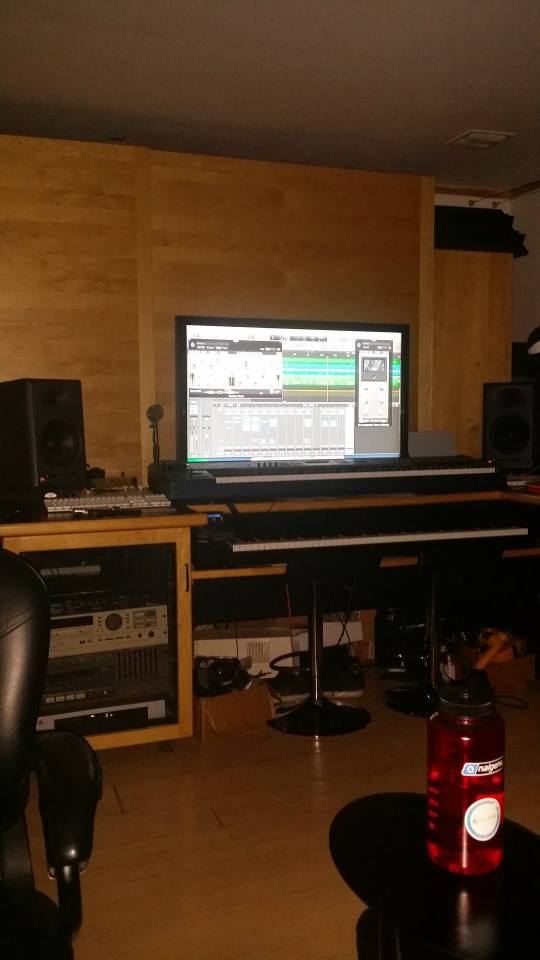 Studio console and DAW session in low light